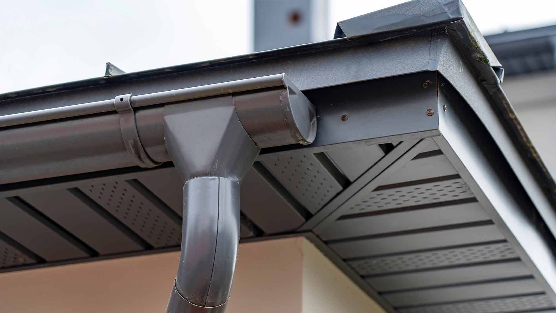 Guttering, fascia and ventilated soffit at the edge of a roof